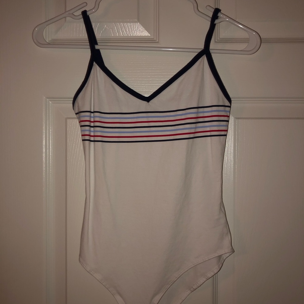 white with blue and red striped bodysuit